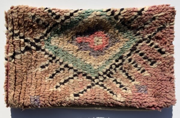 One of a kind. Moroccan pillow made from antique hand woven rugs, 2 sided pillow - plush wool on one side and flat wool on the opposite. 21”x12.50”. SKU 143-11. $95. Insert $50