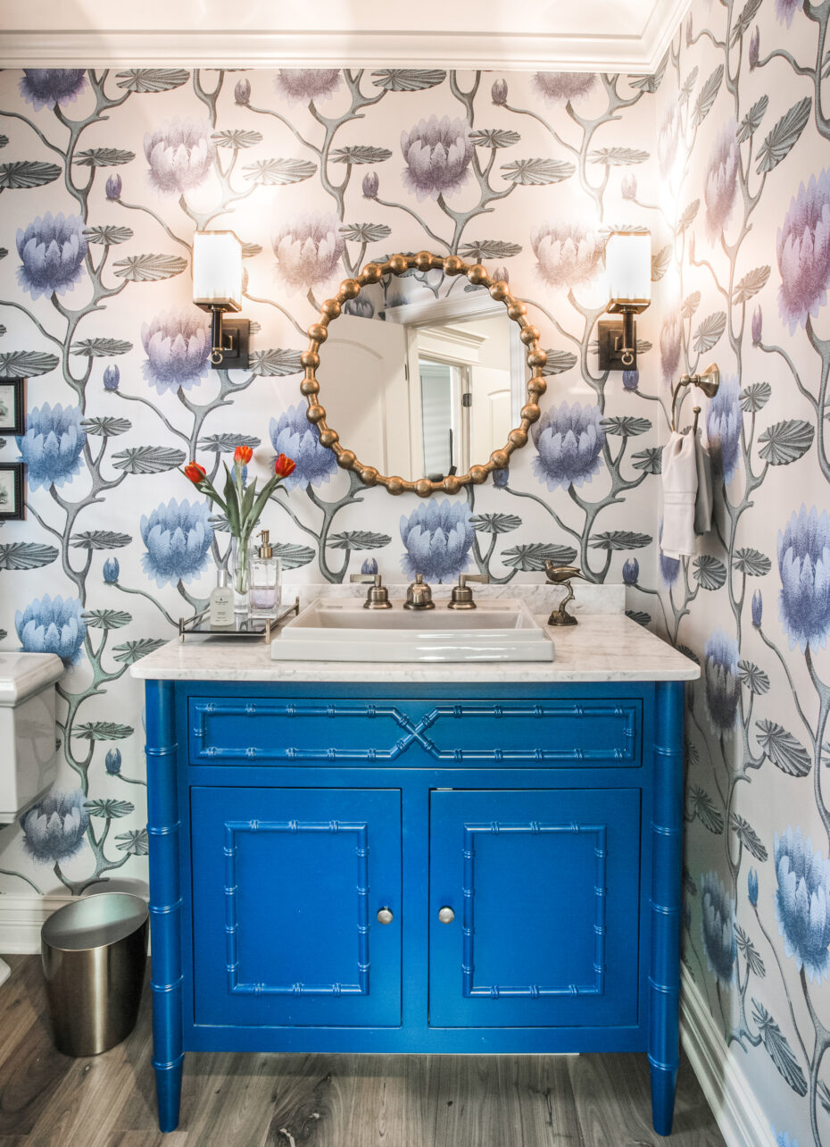 powder room with a j. tribble blue vanity, cole and sons wallpaper, circa lighting