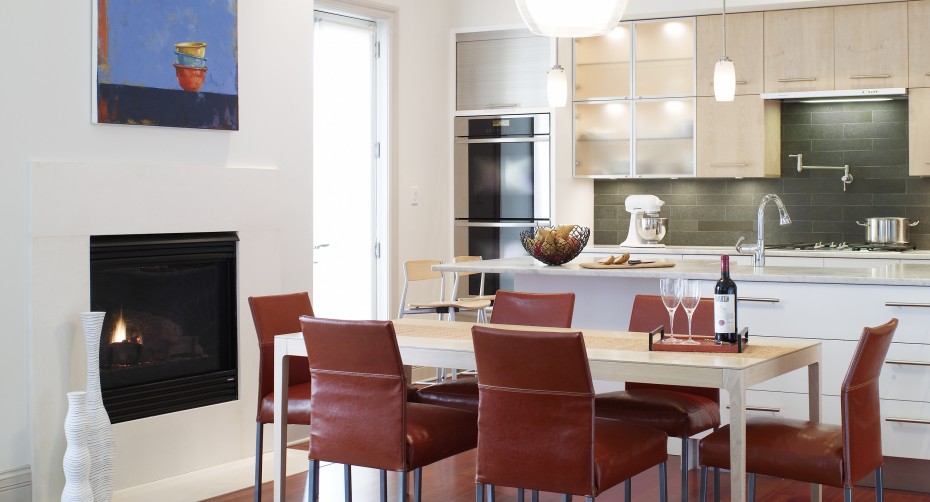 modern white kitchen wit breakfast area white and maple cabinets