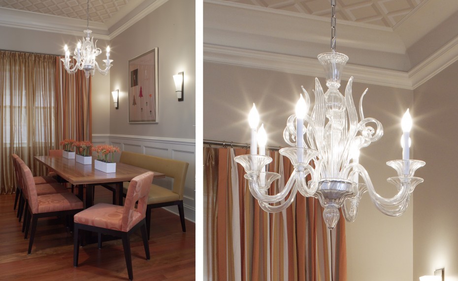 orange dining chairs, dining room with papered ceiling and murano glass chandelier