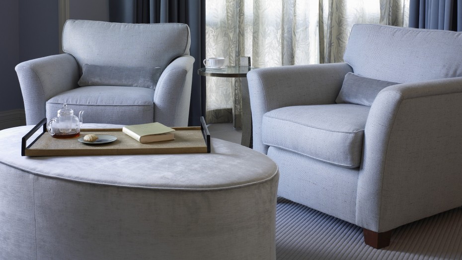 Blue chairs with blue ottoman