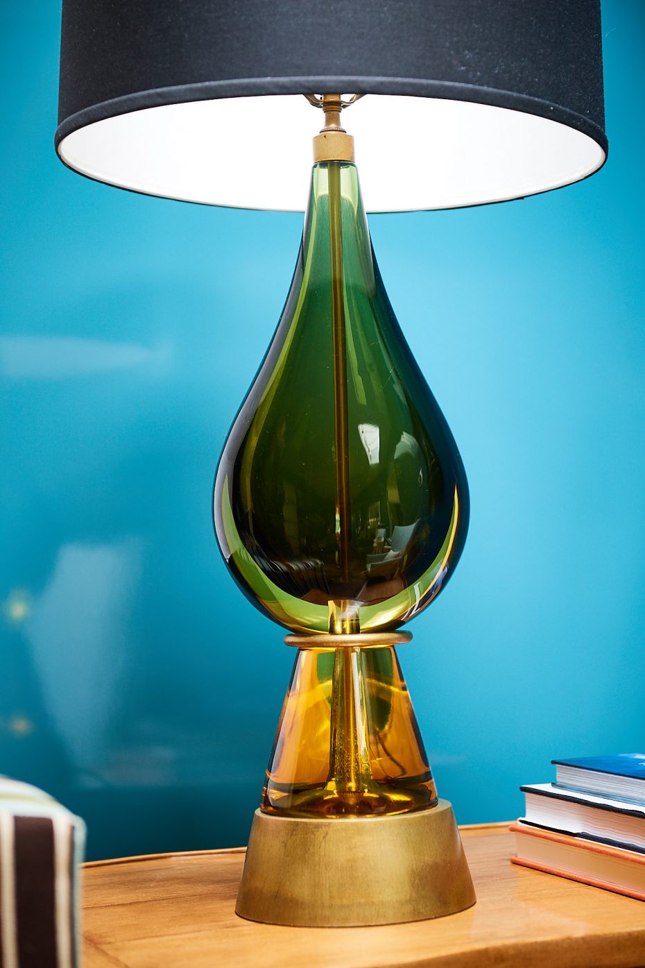 vintage green glass lamp with black shade with blue lacquered walls